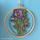 Hanging wooden decoration of a purple flower with buds