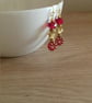 RED AND GOLD FLOWER GLASS BEAD EARRINGS. - Image 1
