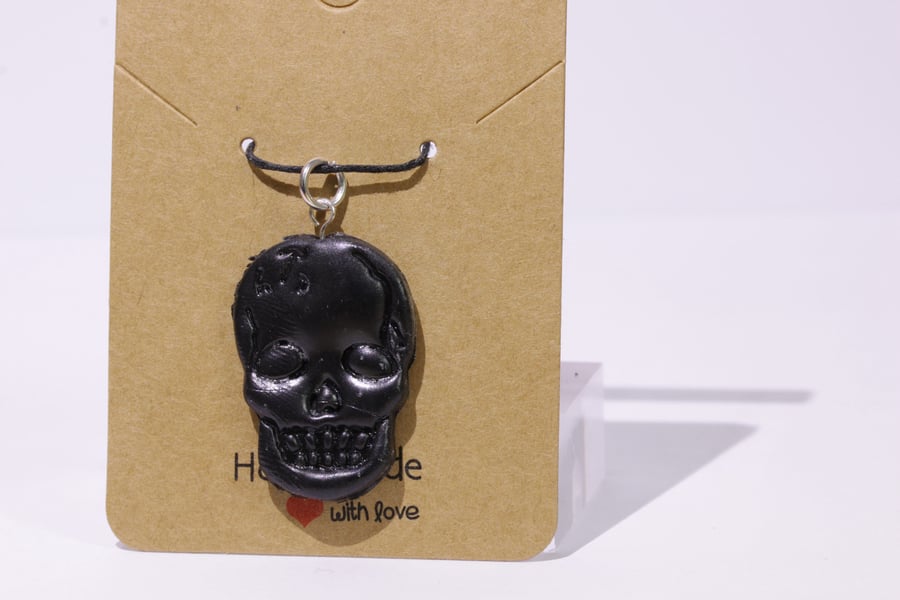 Rustic black skull charm