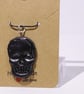 Rustic black skull charm