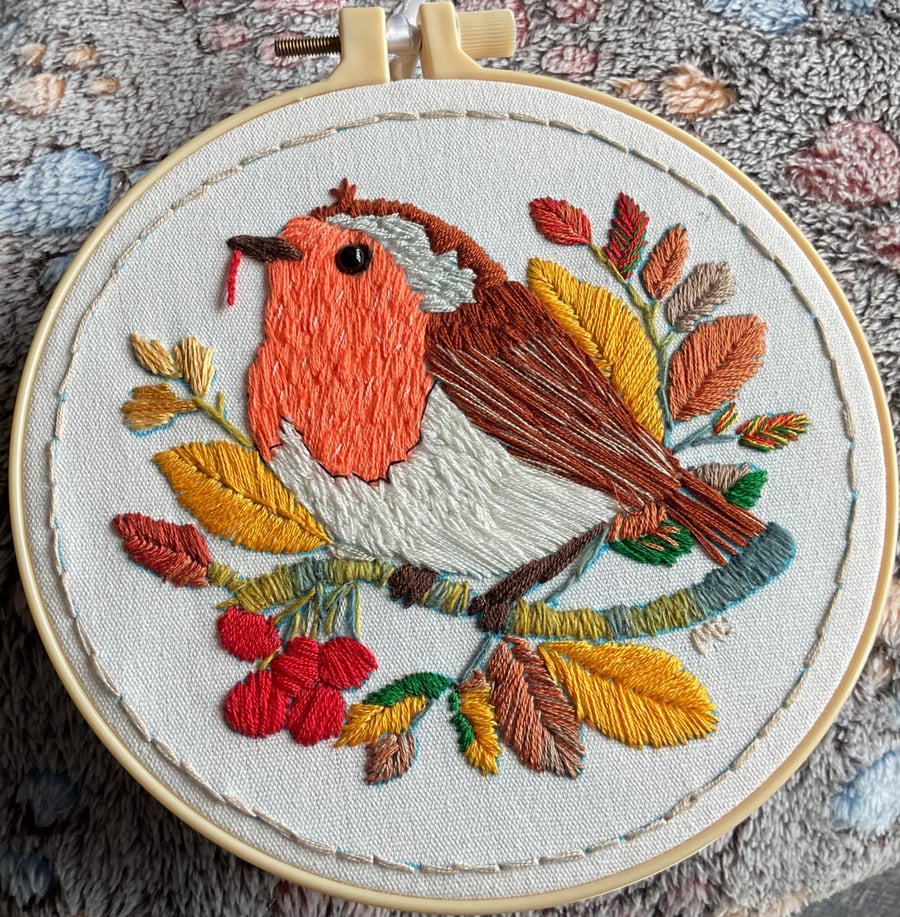 A ROBIN, EATING A WORM . 