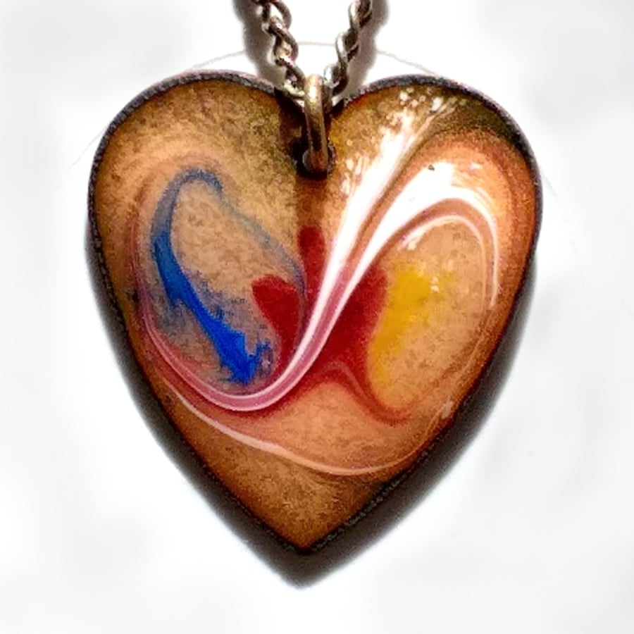 heart pendant - scrolled blue, white, red, yellow over golden brown