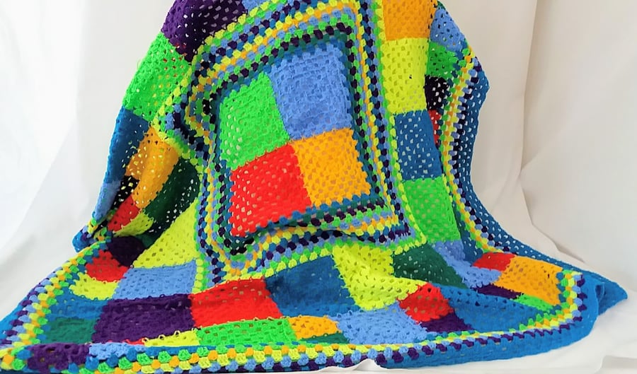 Crochet blanket in bright and cheerful colours.