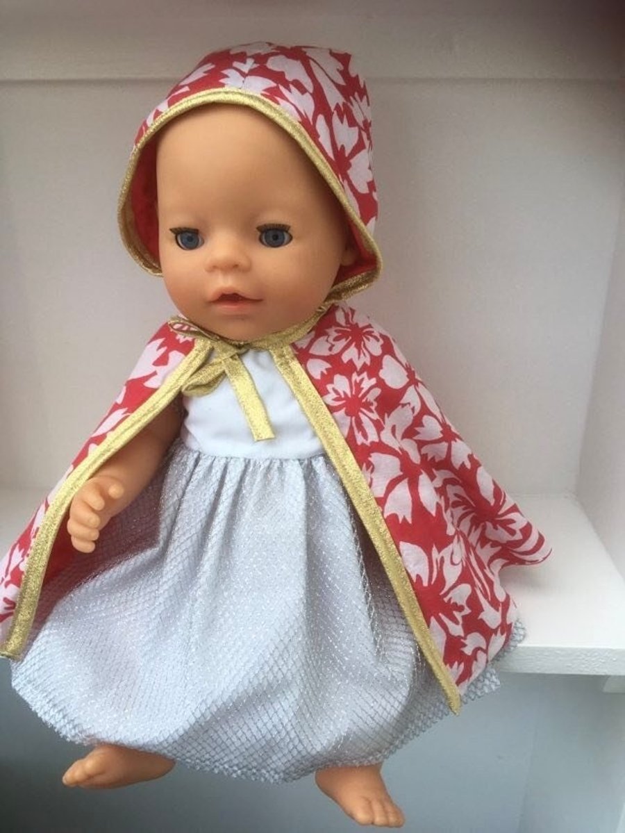 Red patterned cloak with gold trim