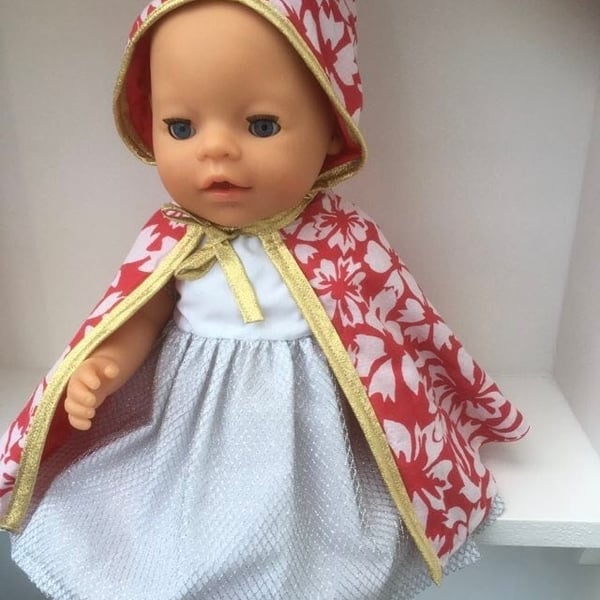 Red patterned cloak with gold trim