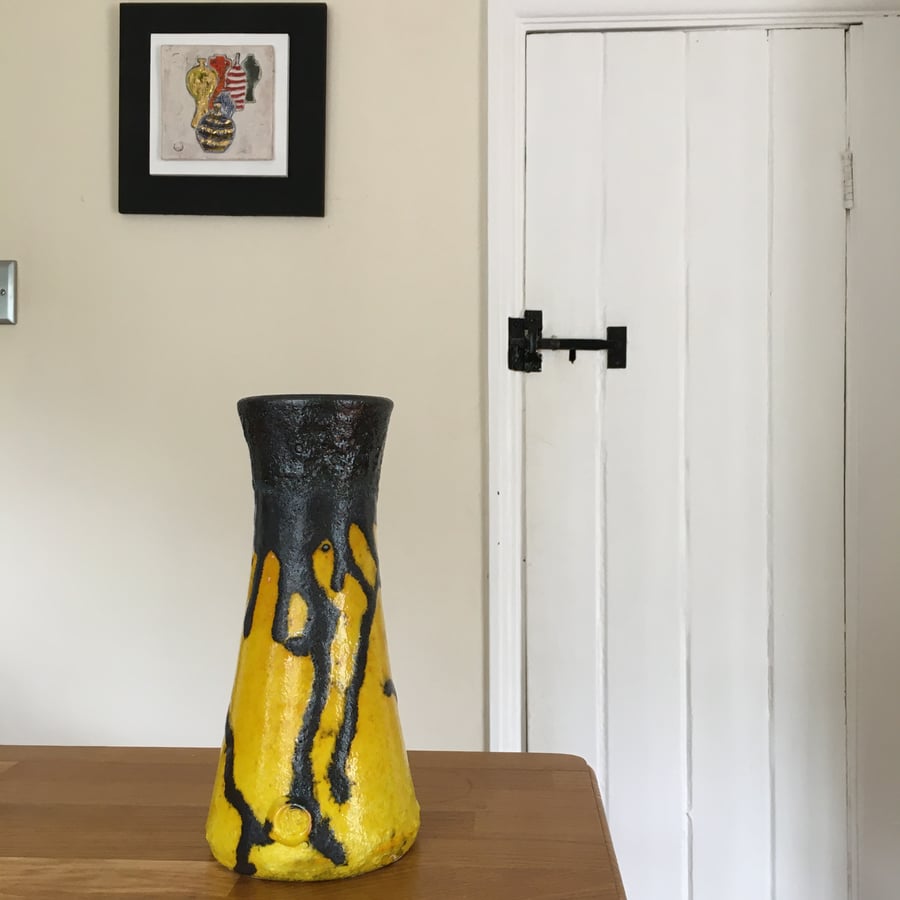 Retro design tubular shaped vase with a Black Lava and vibrant Yellow glaze 