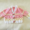 Hand knitted Baby girls cardigan in a pink and yellow mix yarn Newborn 