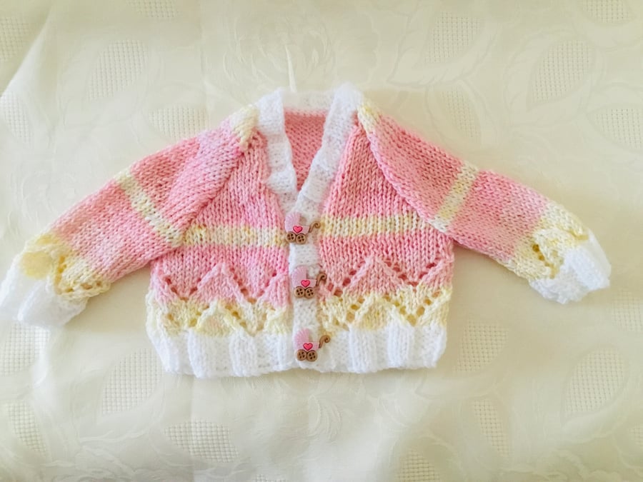 Hand knitted Baby girls cardigan in a pink and yellow mix yarn Newborn 