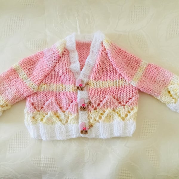 Hand knitted Baby girls cardigan in a pink and yellow mix yarn Newborn 