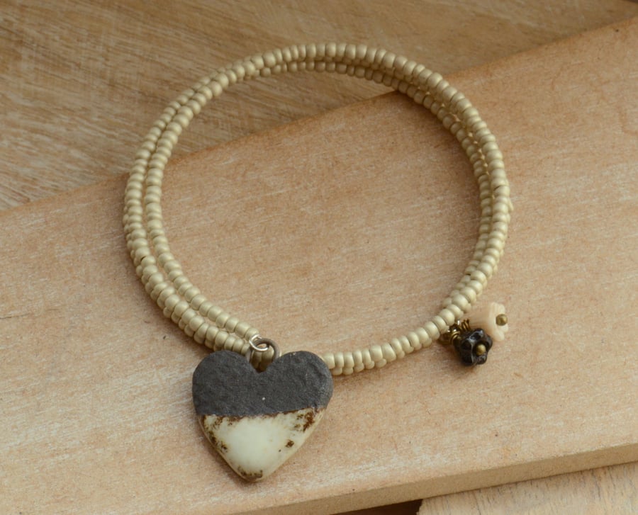 Memory Wire Wrap Cream Seed Bead Bracelet with Ceramic Black Cream Heart