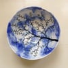 Fruit bowl with tree, blue sky, birds and clouds design.