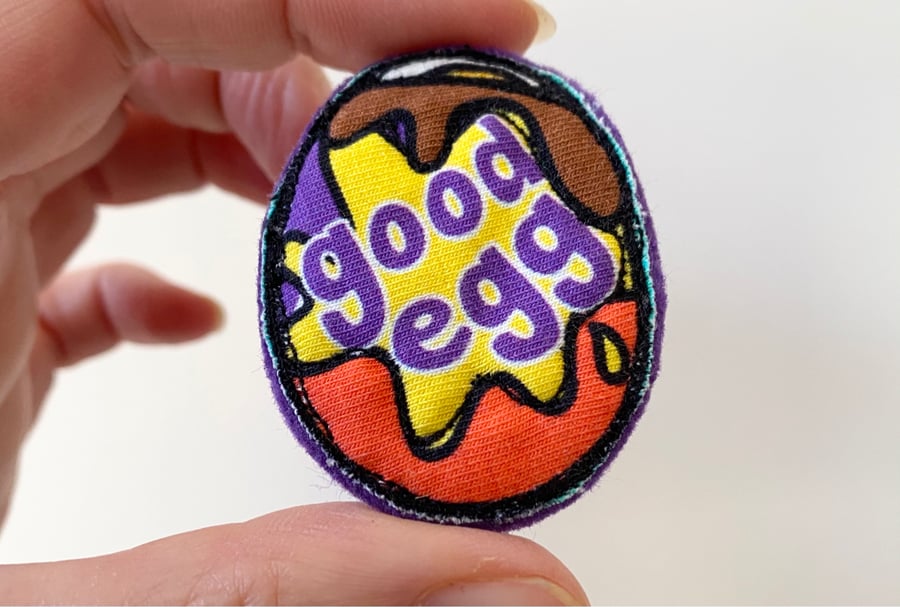 Up-cycled embroidered chocolate egg brooch pin or badge. 