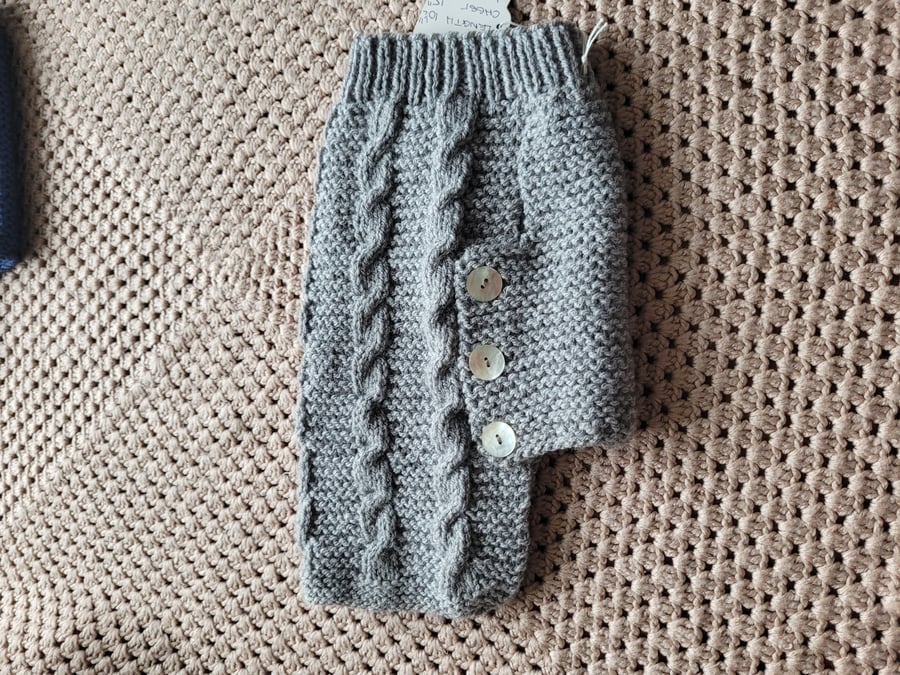 Hand knitted dog coat in grey. 