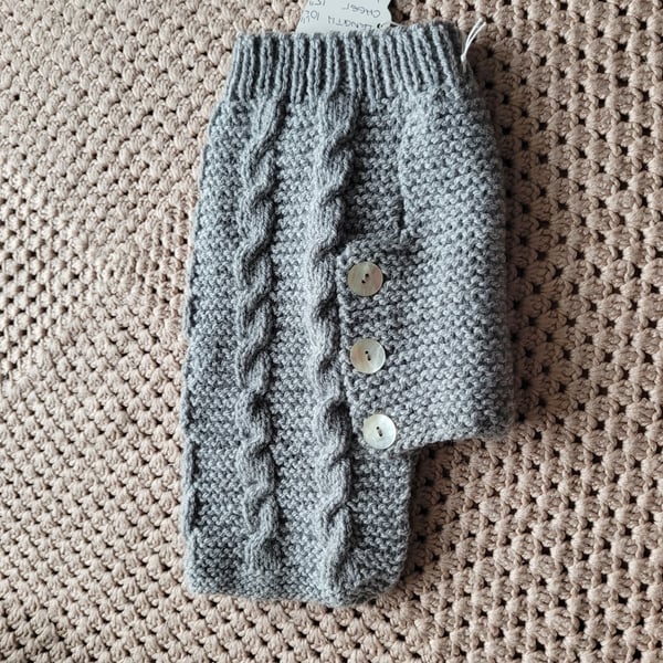 Hand knitted dog coat in grey. 