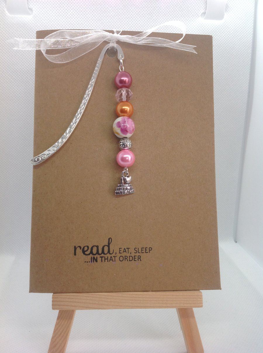 An A6 Kraft card with hand made bookmark attached.