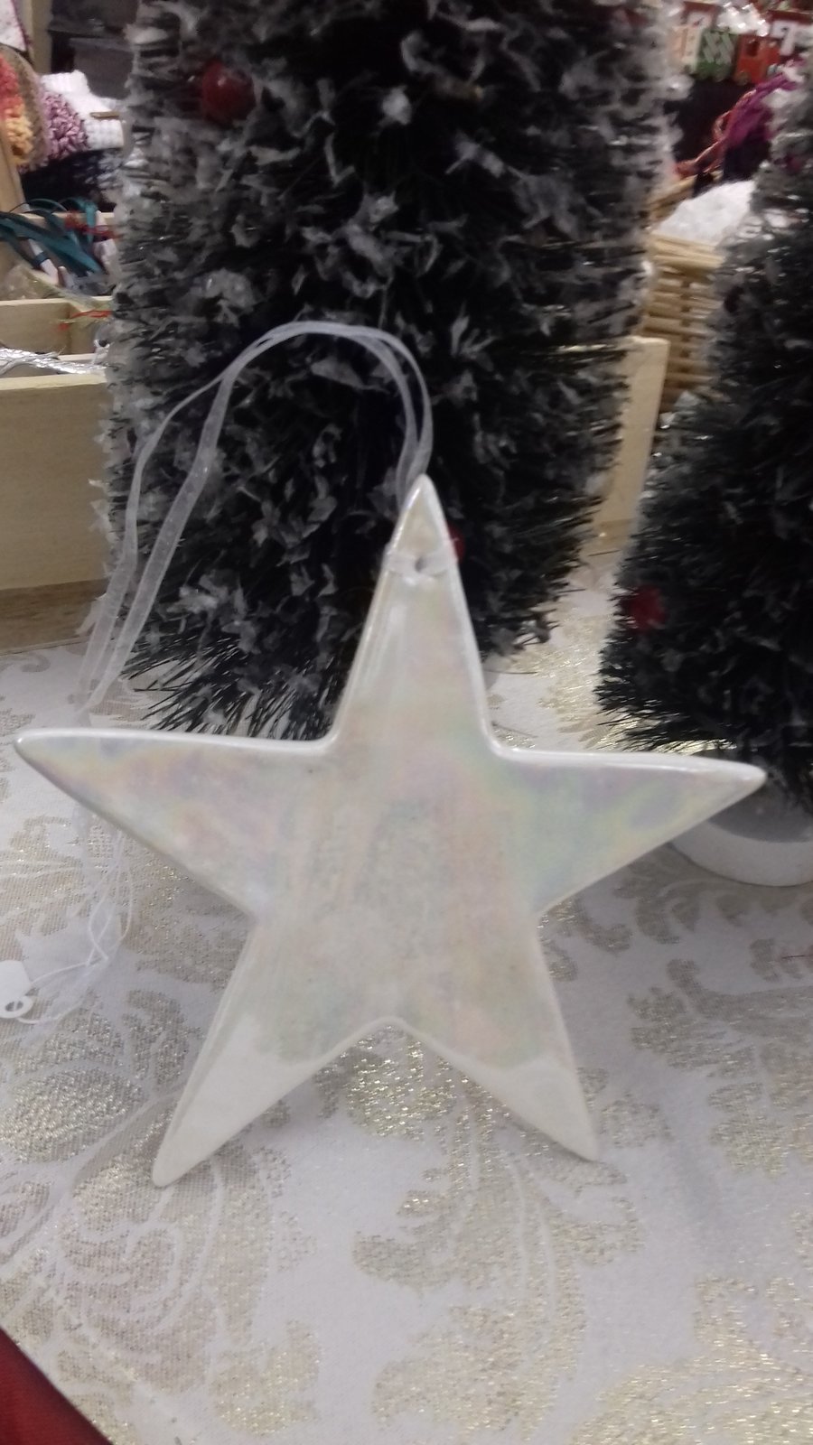 Handmade porcelain paper clay star hanging decorationwith mother of pearl lustre