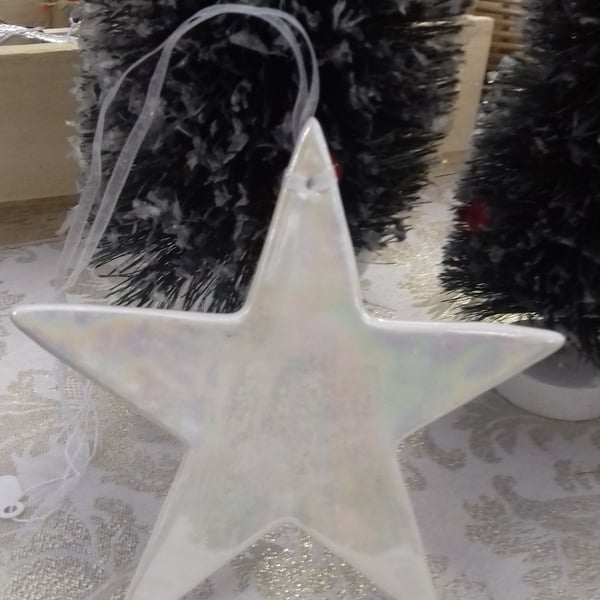 Handmade porcelain paper clay star hanging decorationwith mother of pearl lustre