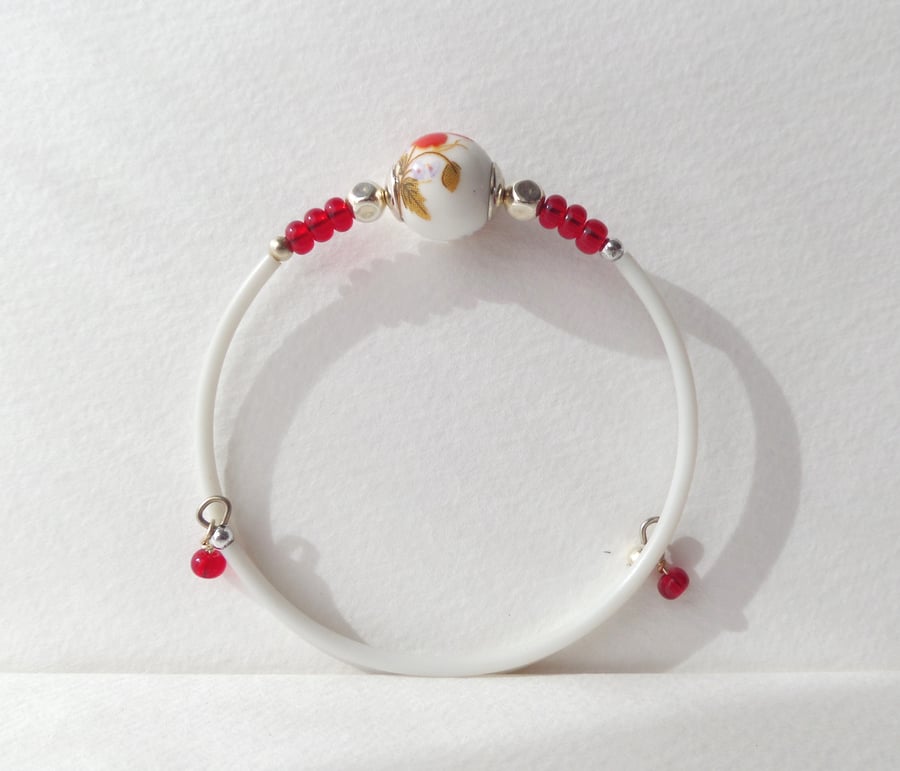 Red and White Bangle, Rubber coated single coil bangle