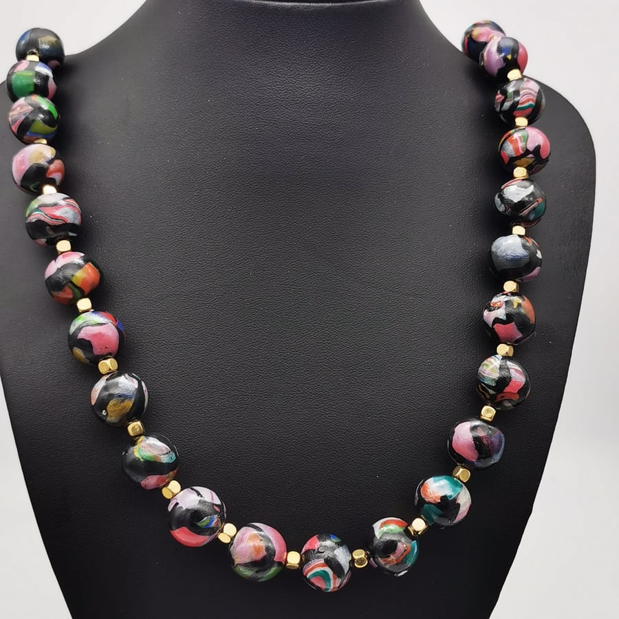  Unique, handmade, multi-coloured and black bead necklace.