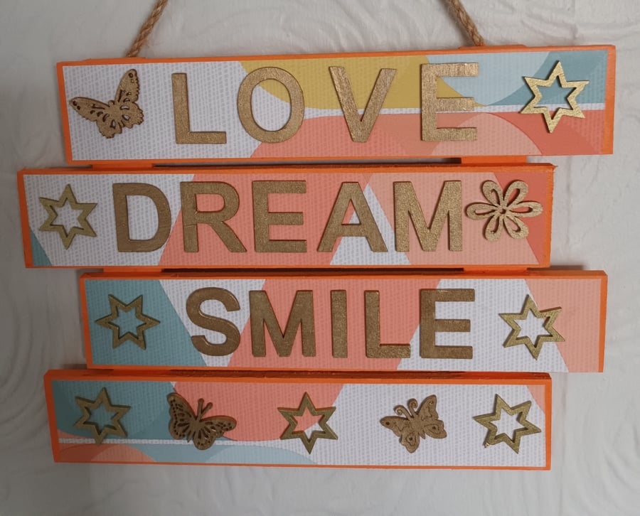 Hand decorated wooden plaque.