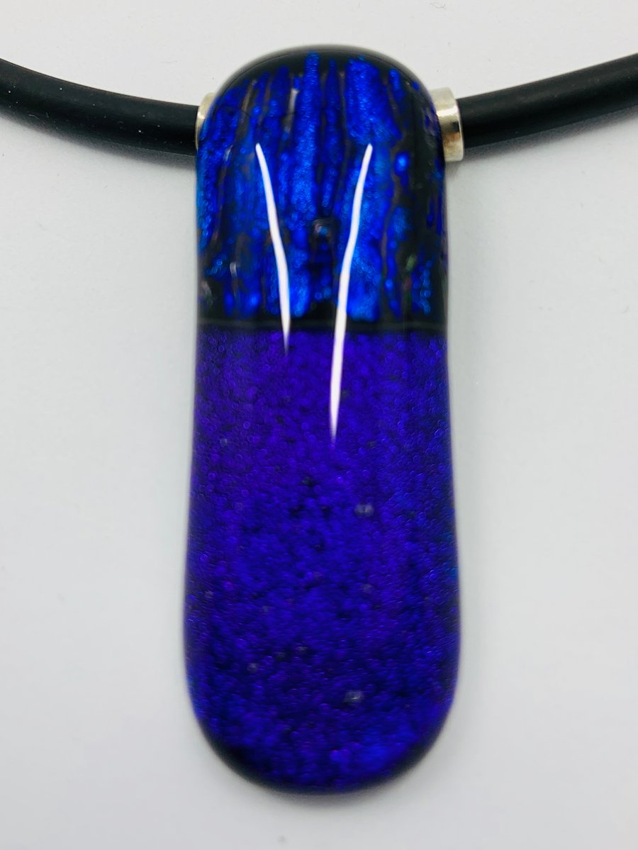 Purple & Blue Fused dichroic glass pendant with tube bail and black necklace.