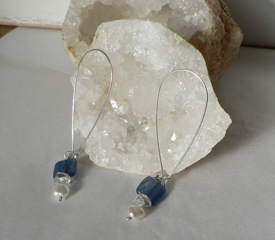 Long drop earrings with a blue bead and pearl
