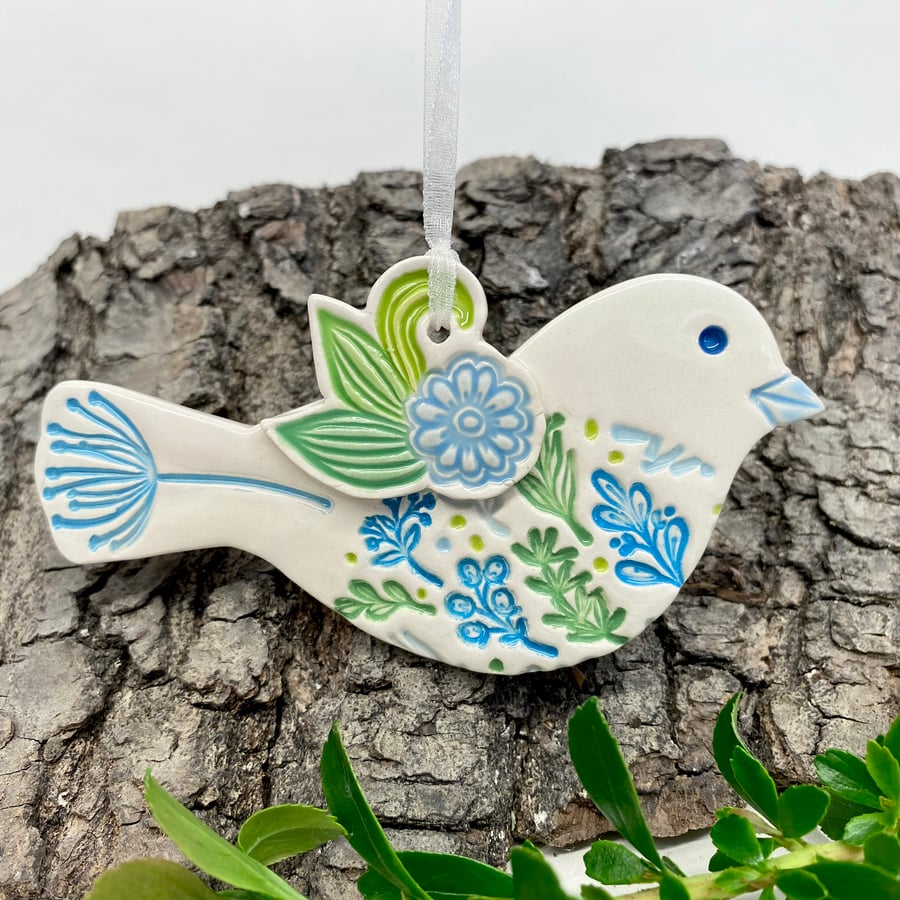Ceramic bird hanging decoration with blue flower detail