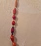 Orange paper and glass beaded necklace