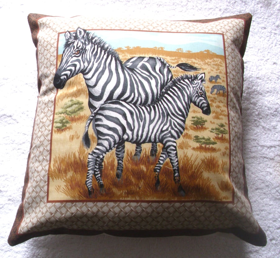 On Safari Zebra and young  standing on a  grassy plain cushion