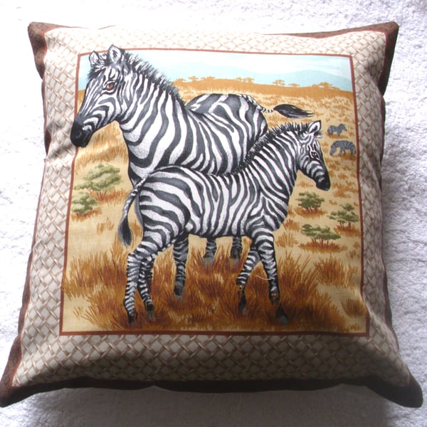 On Safari Zebra and young  standing on a  grassy plain cushion