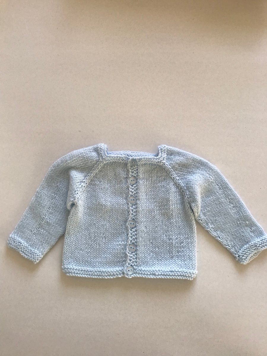 Hand knitted baby cardigan with a square neck