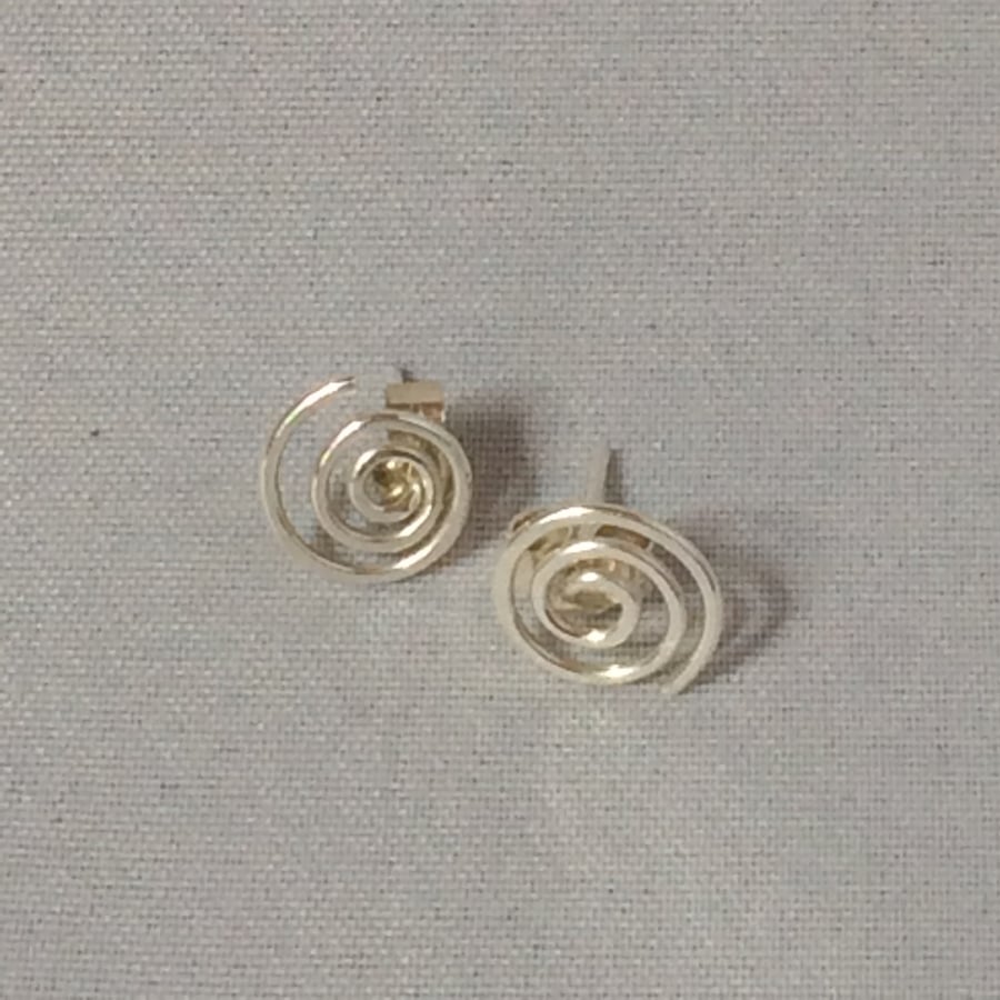 Silver swirl studs