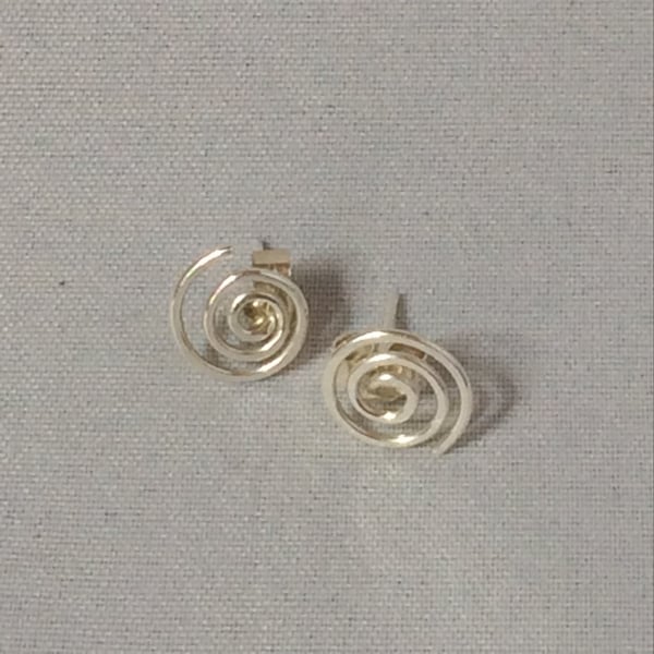 Silver swirl studs