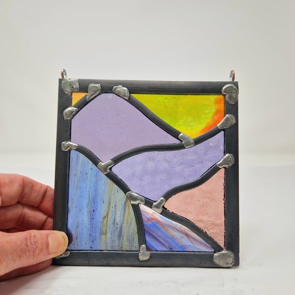Purple Scottish landscape with orange sunset - stained glass leaded panel