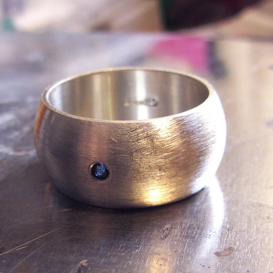 Sterling silver D ring for men with a blue Sapphire and brushed silver finish