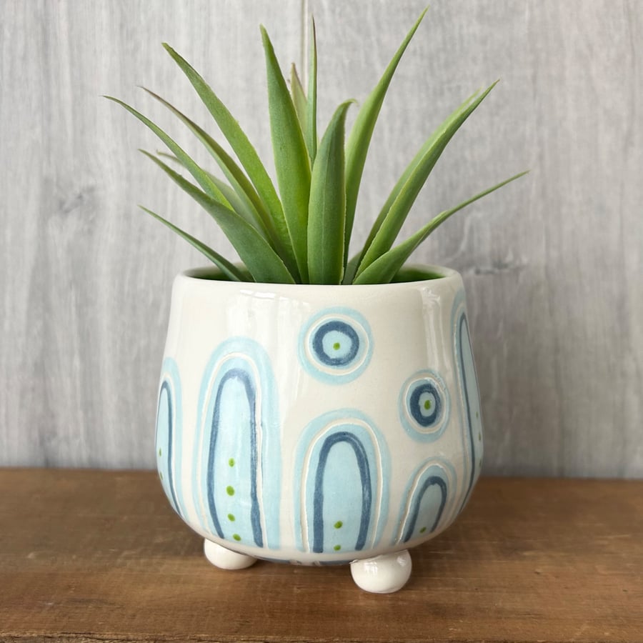 Ceramic hand thrown pot with feet