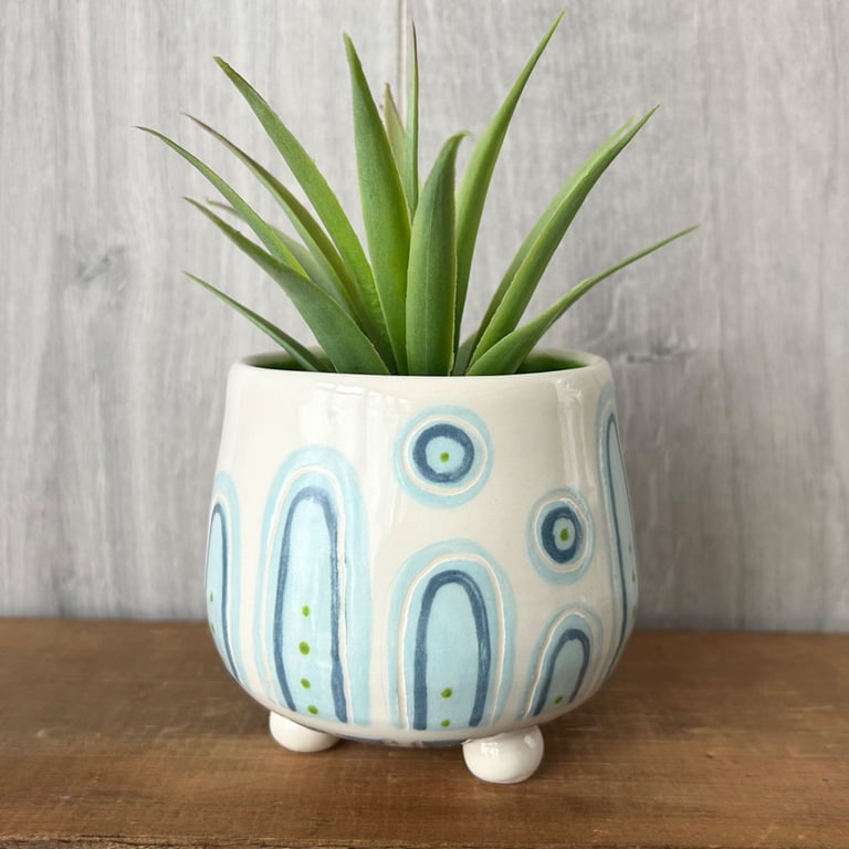 Ceramic hand thrown pot with feet
