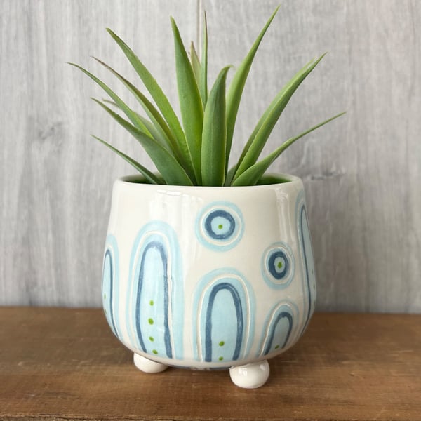 Ceramic hand thrown pot with feet
