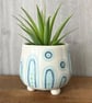 Ceramic hand thrown pot with feet
