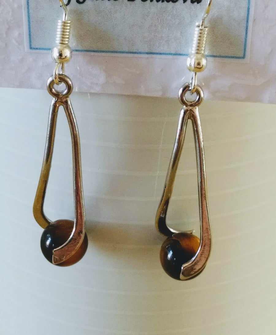 Tiger eye dangle gemstone earrings.