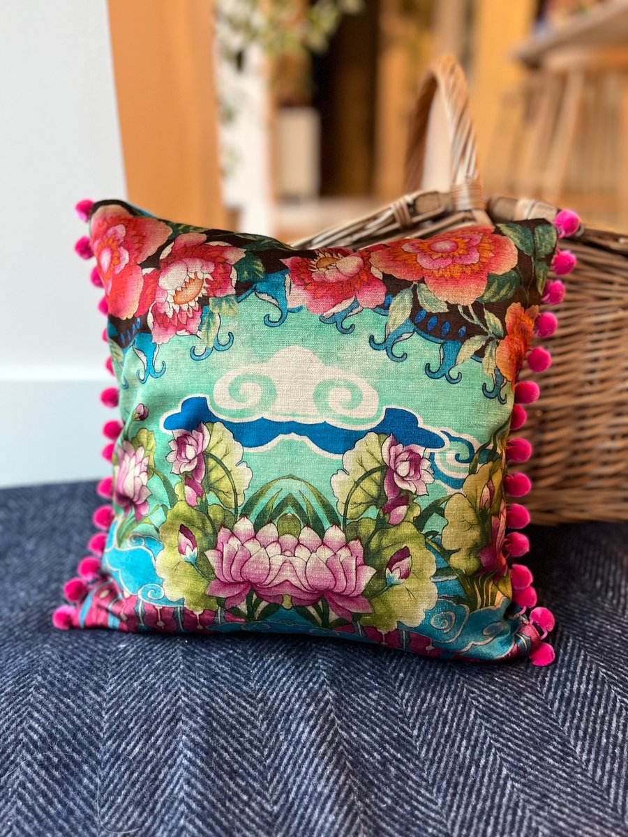 Torcello velvet cushion with bright pink pompoms colourful home