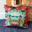Torcello velvet cushion with bright pink pompoms colourful home