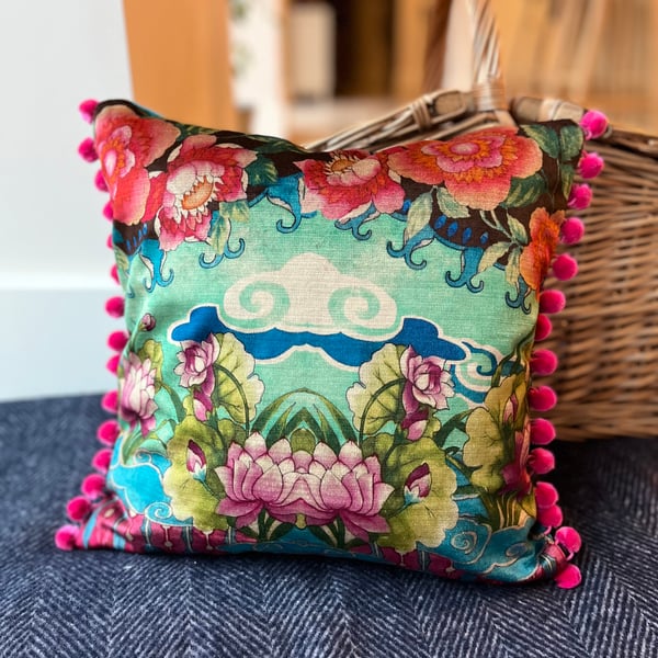 Torcello velvet cushion with bright pink pompoms colourful home