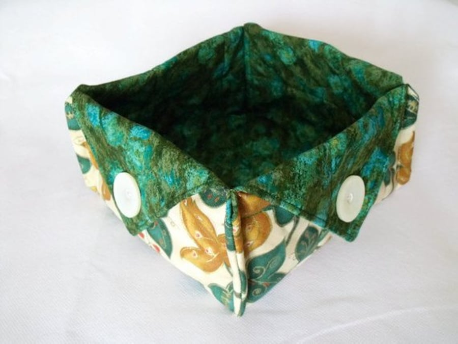 folded fabric storage tub for your bits and bobs, leaf print fabric, green