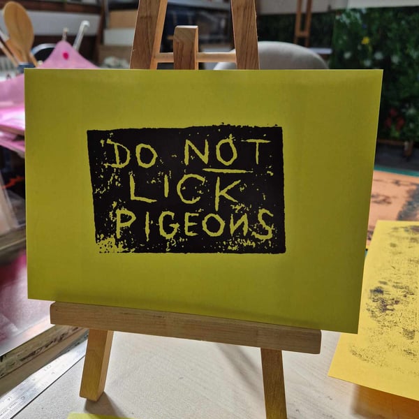 DO NOT LICK PIGEONS A5 black and yellow print.