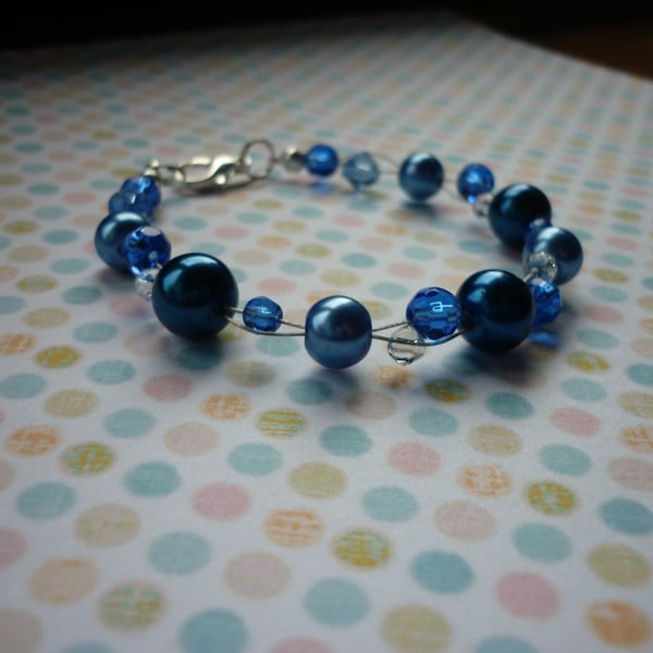 SHADES OF BLUE AND CRYSTAL BRACELET.