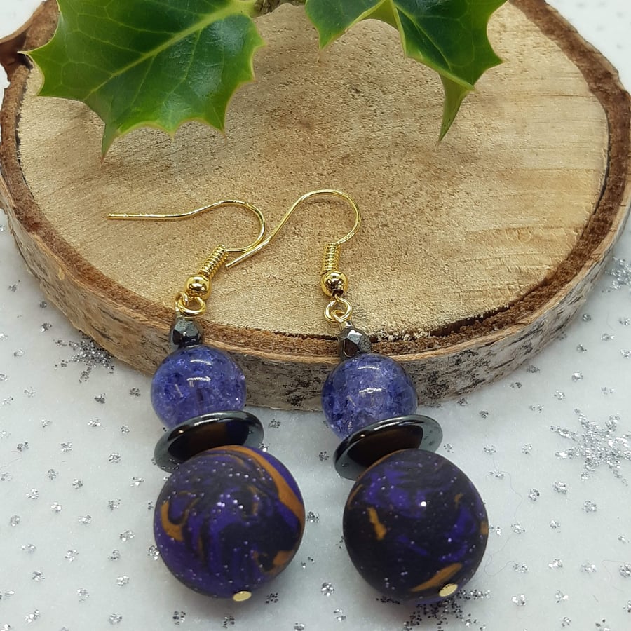 Purple, black and gold dangly earrings