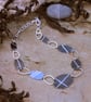 Reversible pebble necklace, anodised aluminium and recycled silver. - Image 1