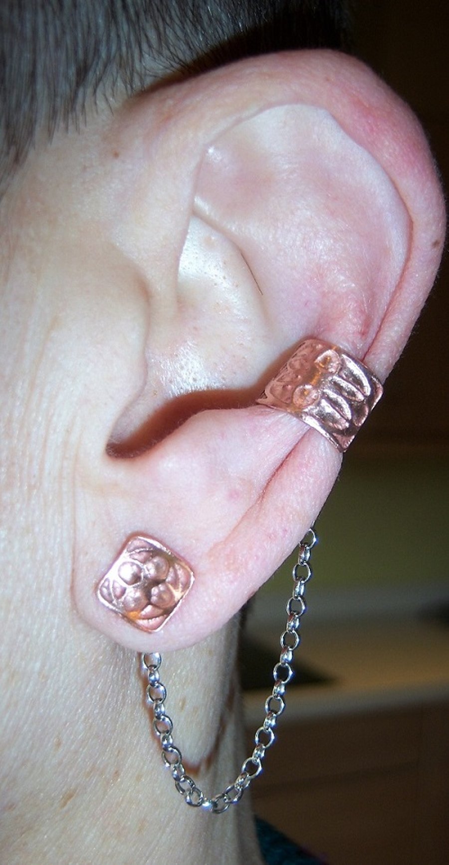 Ear cuff in etched copper with chain attached stud