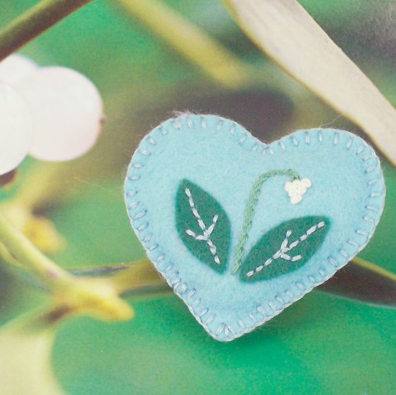 Hand embroidered felt brooch with appliqued snowdrop